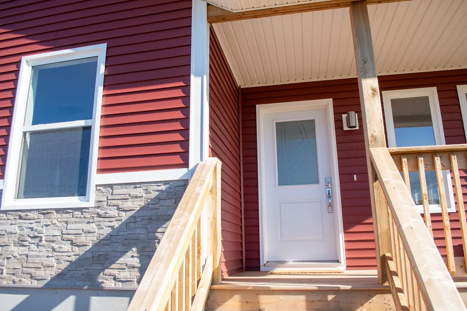 kent-homes-nook-entry-red-siding-porch.jpg