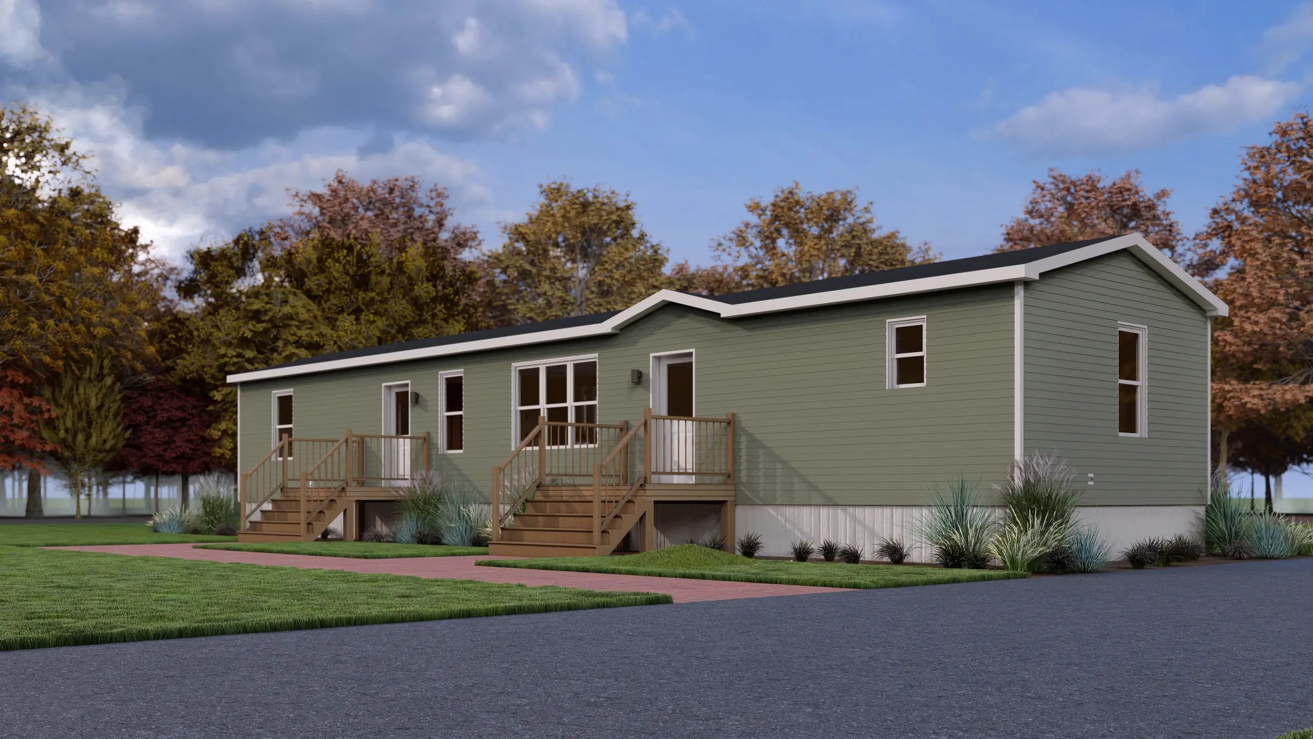 Contemporary mini home featuring soft green siding, two covered entry decks, black exterior lights, and cottage-style landscaping along a paved walkway. 