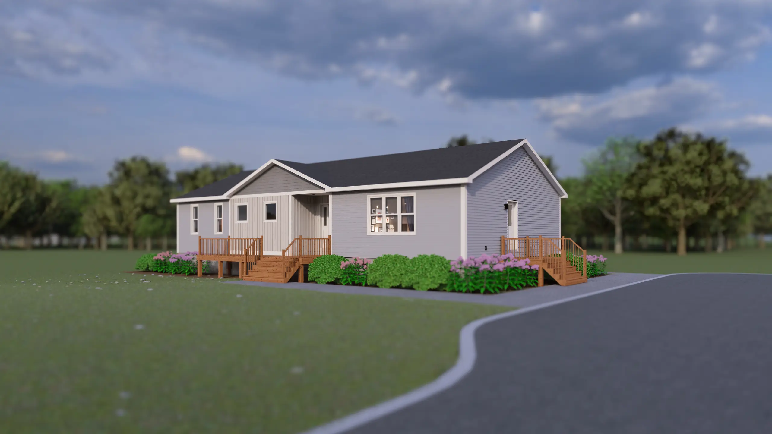 Angled front view of a modern bungalow with a covered entry, dual wood decks, light grey exterior, and landscaped gardens. 