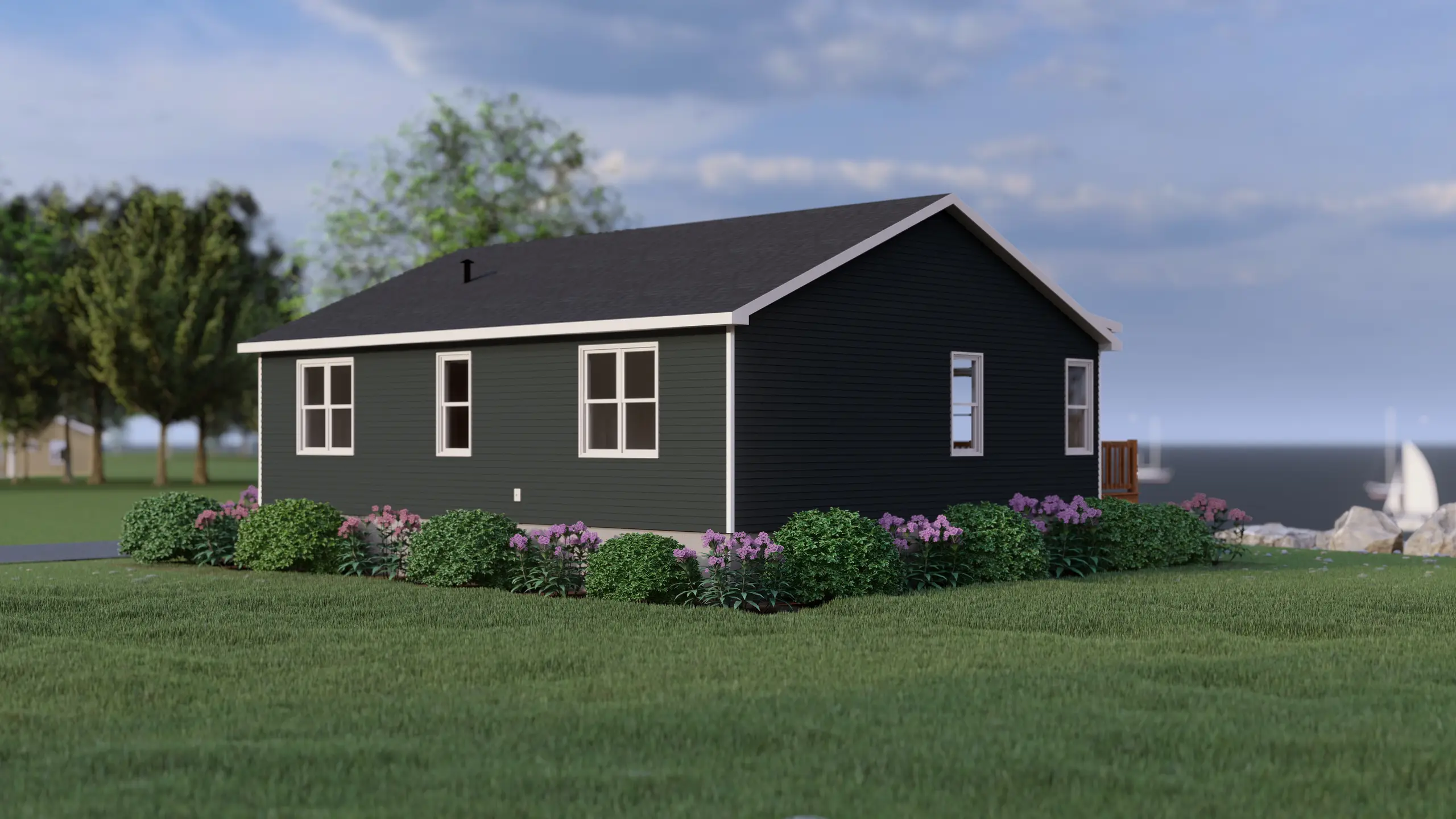 Rear-side perspective of a modern bungalow featuring dark siding, large windows, manicured landscaping, and waterfront surroundings. 