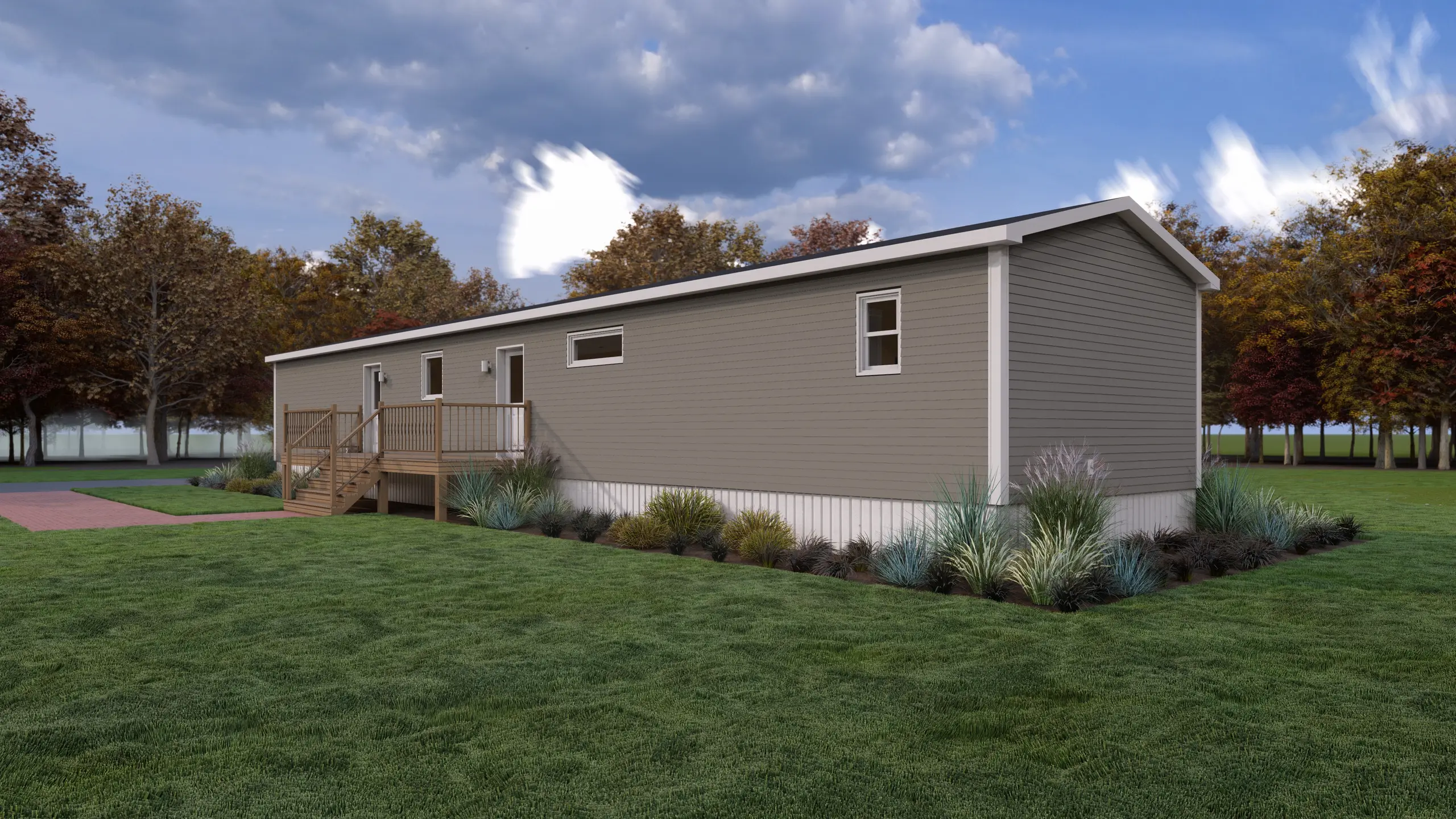 Rear angled view of a mini home showcasing a raised wood deck, multiple exterior doors, horizontal accent windows, and surrounding landscaping. 