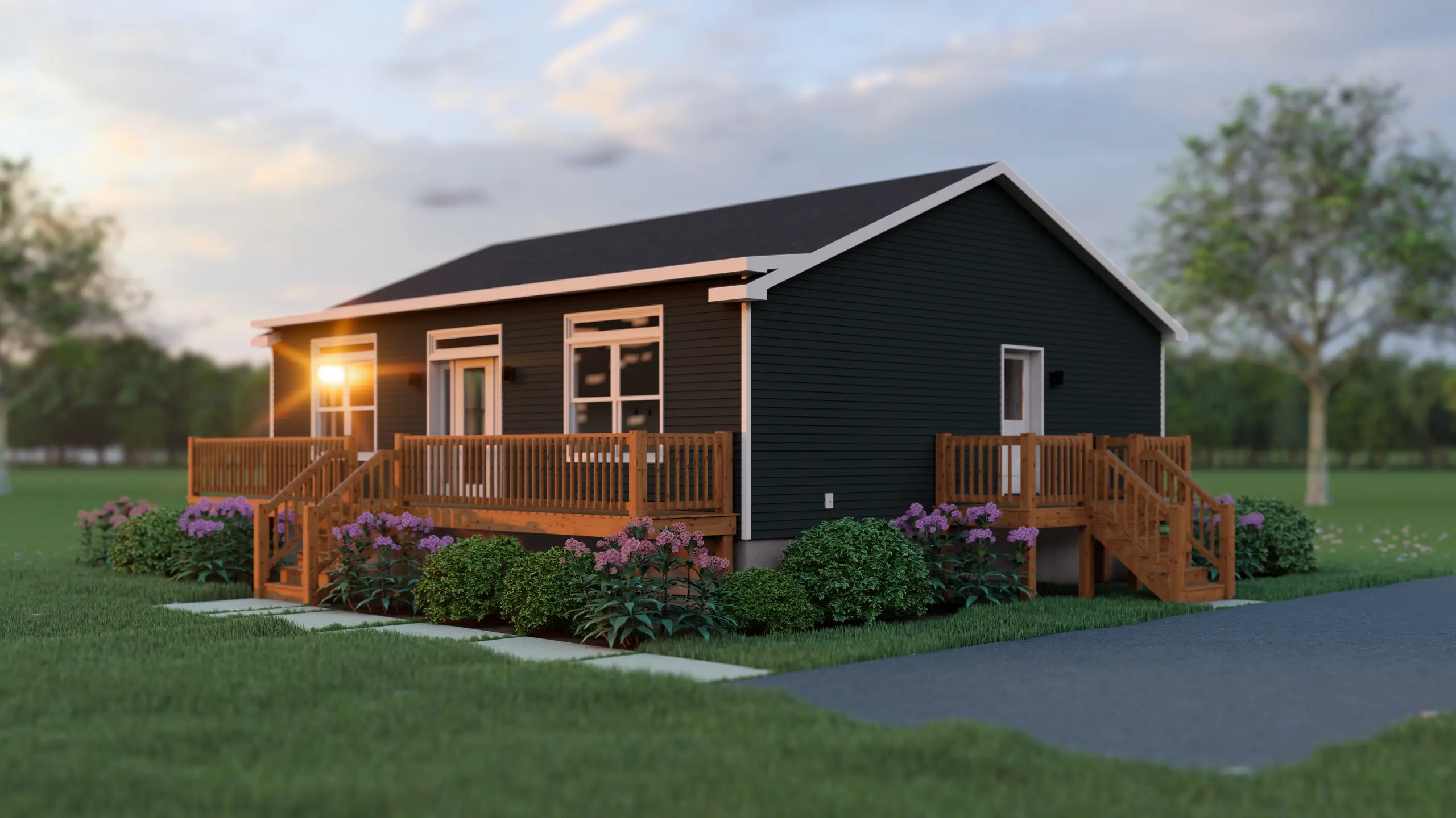 Angled view of a dark-sided bungalow featuring wraparound deck access, large windows, colourful flower beds, and mature landscaping. 