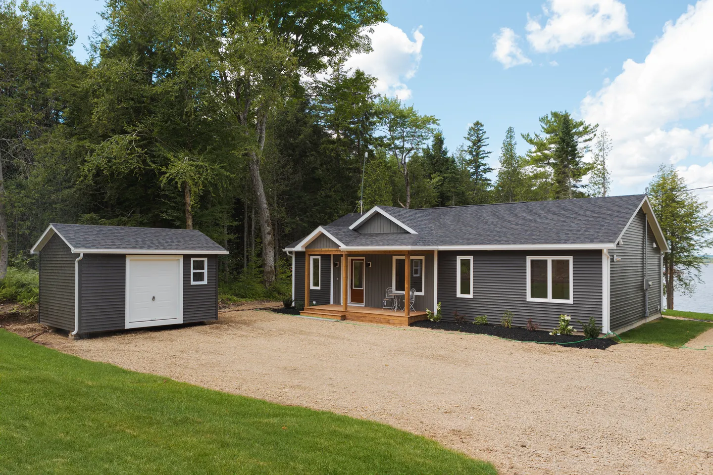 kent-homes-cottage-exterior-detached-shed-waterfront.jpg