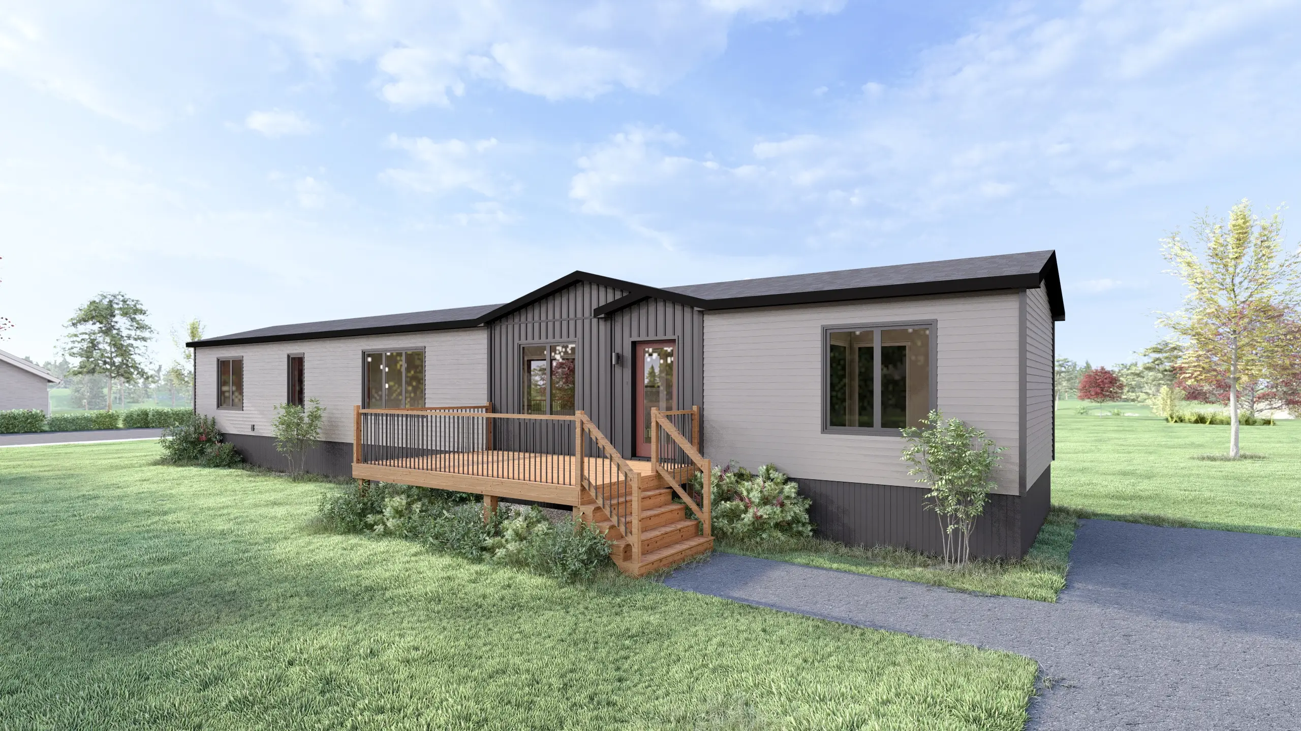 Front angled view of a contemporary mini home featuring light grey siding, a dark vertical accent façade, central entry deck, and landscaped garden beds. 