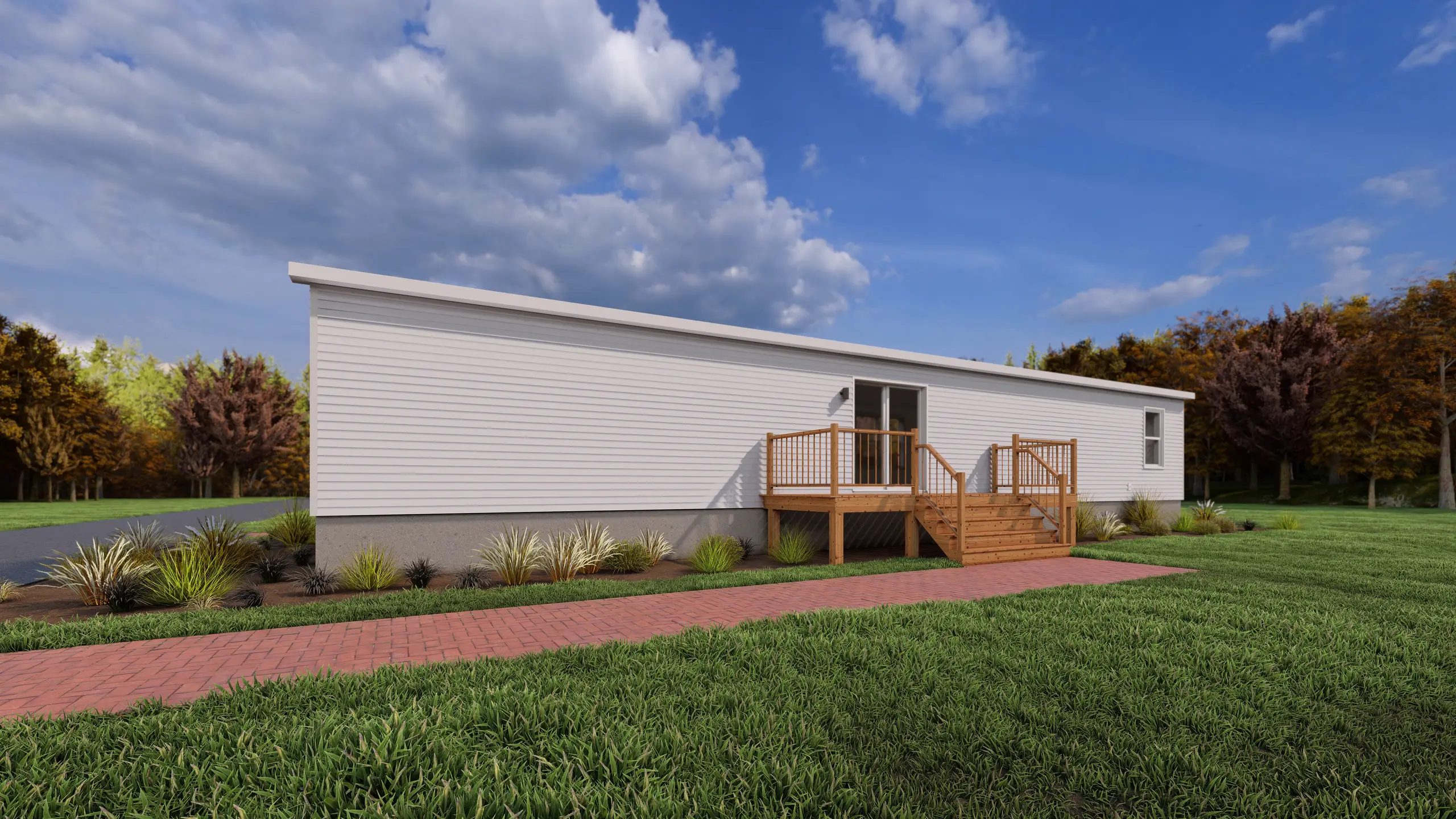 Side view of a contemporary mini home with a rear entry deck, sliding patio door, light grey exterior siding, and landscaped garden beds. 
