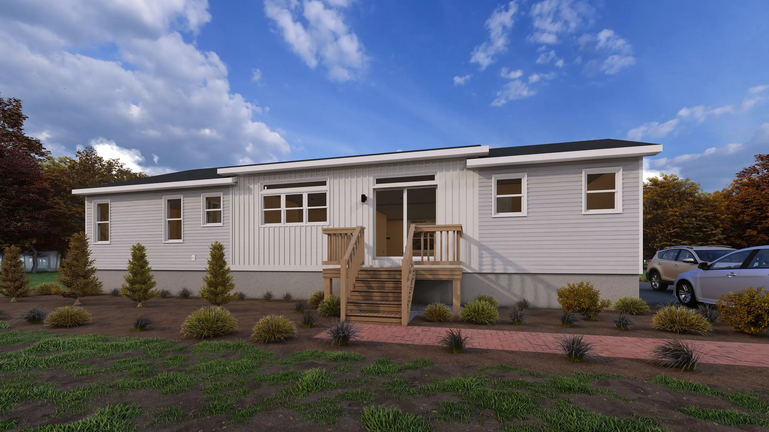 Rear view of a contemporary modular bungalow with patio doors, large living room window, wood stairs, and landscaped backyard. 