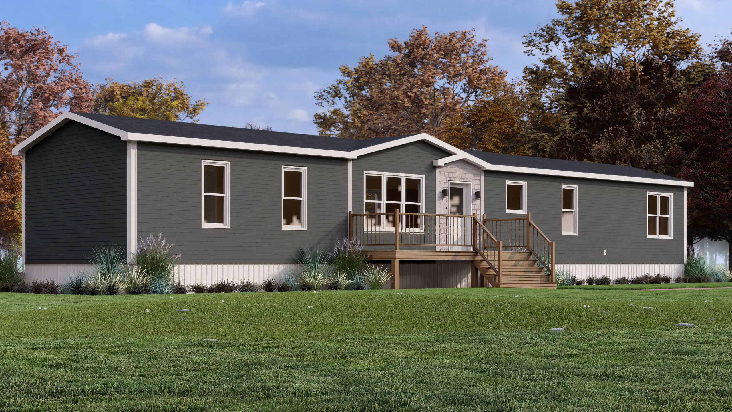 Front angled view of a contemporary mini home showcasing charcoal siding, a central covered porch, decorative façade accents, and low-maintenance landscaping. 