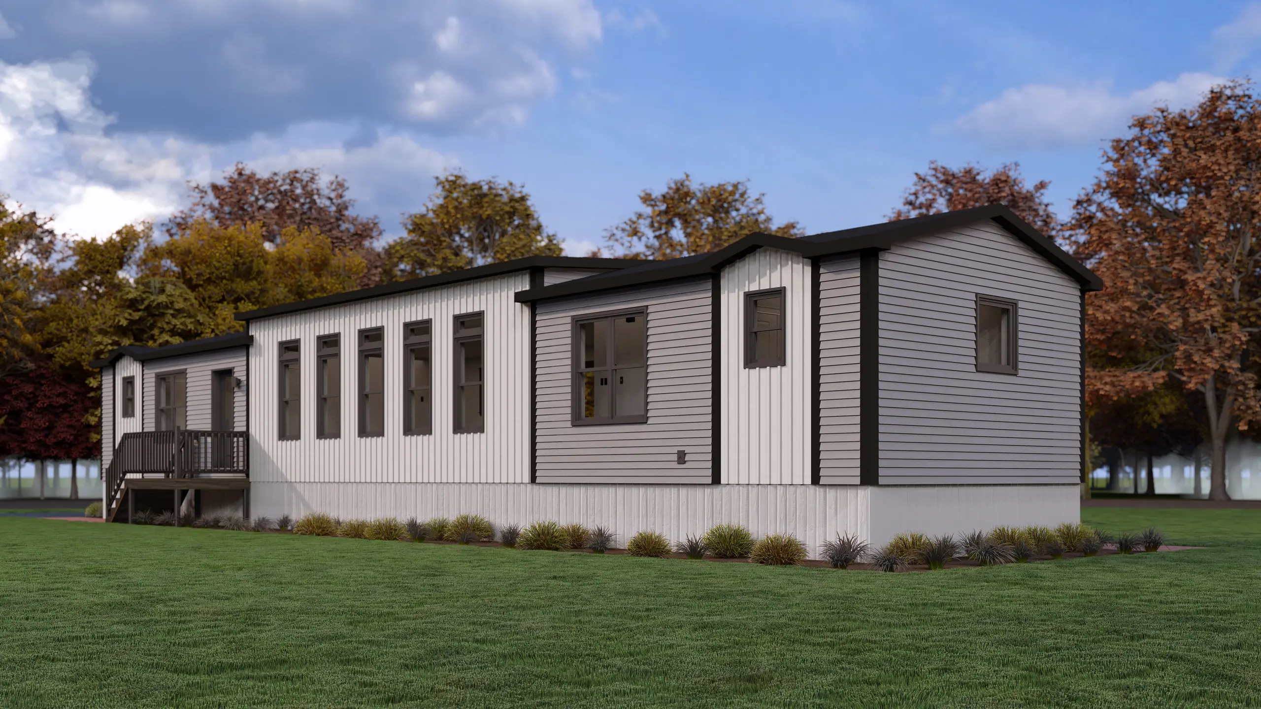 Rear angled view of a contemporary modular home showcasing a mix of vertical and horizontal siding, large windows, and clean architectural lines. 