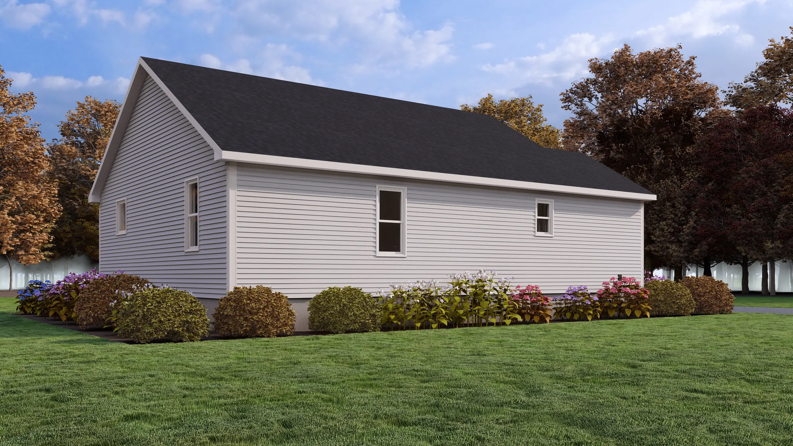 Side view of a contemporary bungalow with light grey siding, black roof, and landscaped flower beds surrounding the home. 