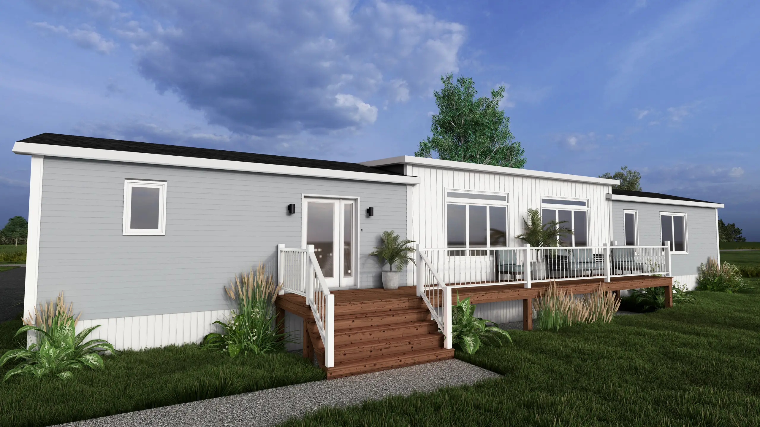 Front view of a contemporary mini home showcasing a central elevated deck, large windows, vertical accent siding, and coastal-inspired landscaping. 