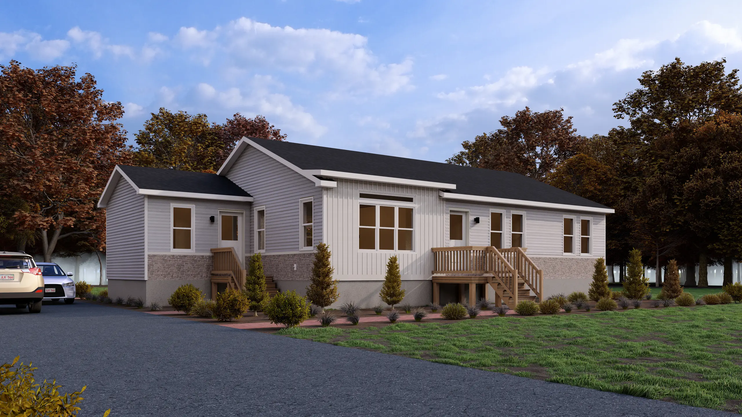 Modern single-storey modular bungalow with light grey siding, black roof, wood entry stairs, and landscaped front yard viewed from the driveway. 