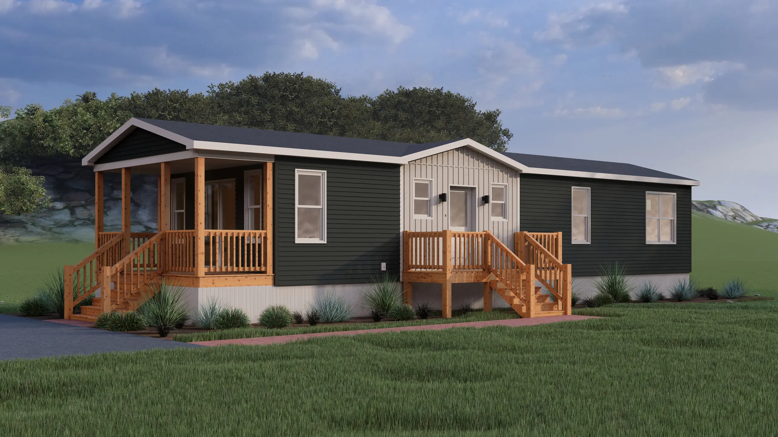 Front angled view of a contemporary mini home featuring dark charcoal siding, a light board-and-batten accent façade, dual entry decks, and landscaped foundation plantings. 
