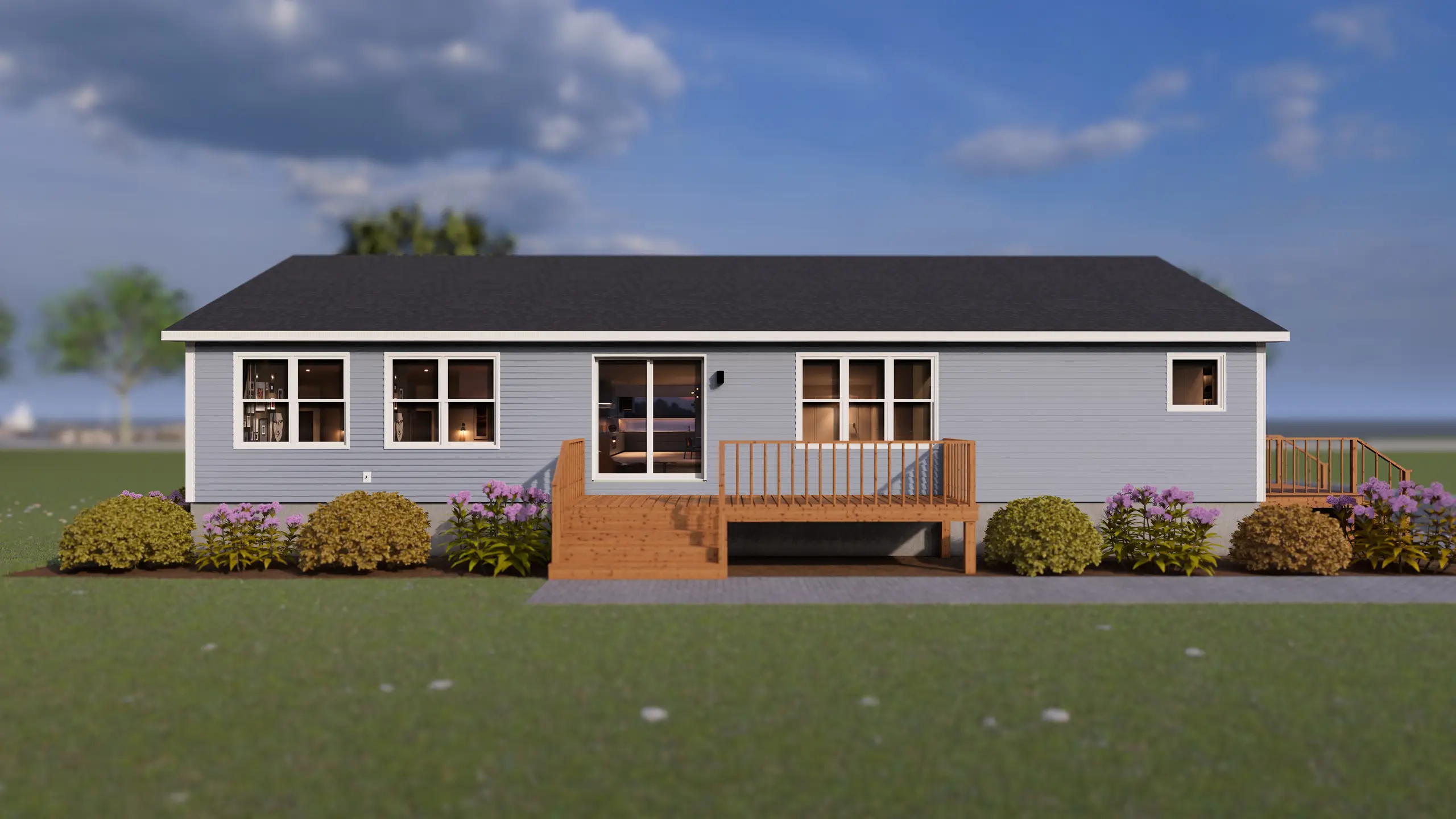 Rear view of a contemporary bungalow with a raised backyard deck, large patio doors, expansive windows, and landscaped garden beds. 