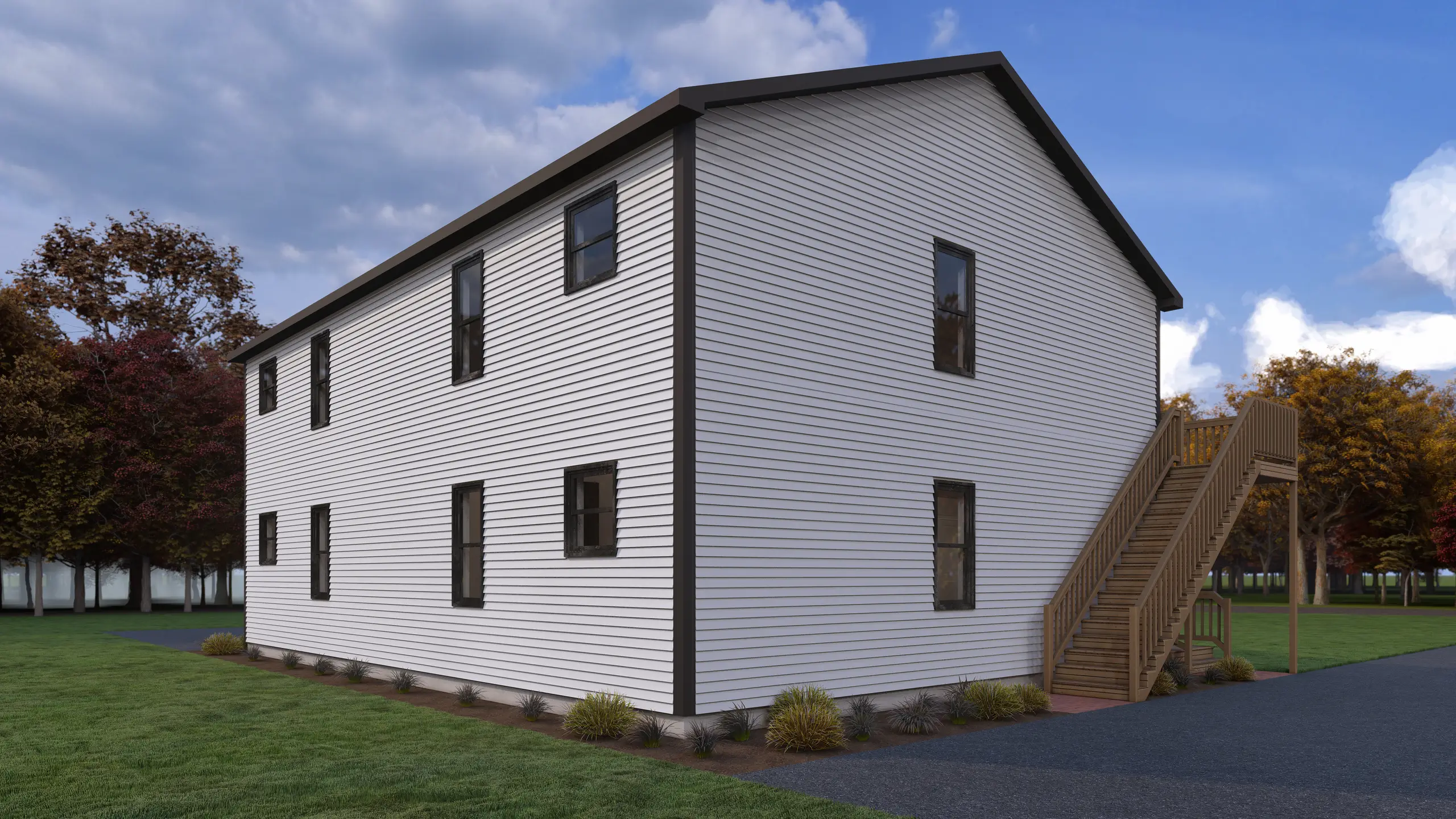 Side and rear view of a multi-unit residential building with low-maintenance white siding, exterior staircase access, landscaped grounds, and private balconies. 