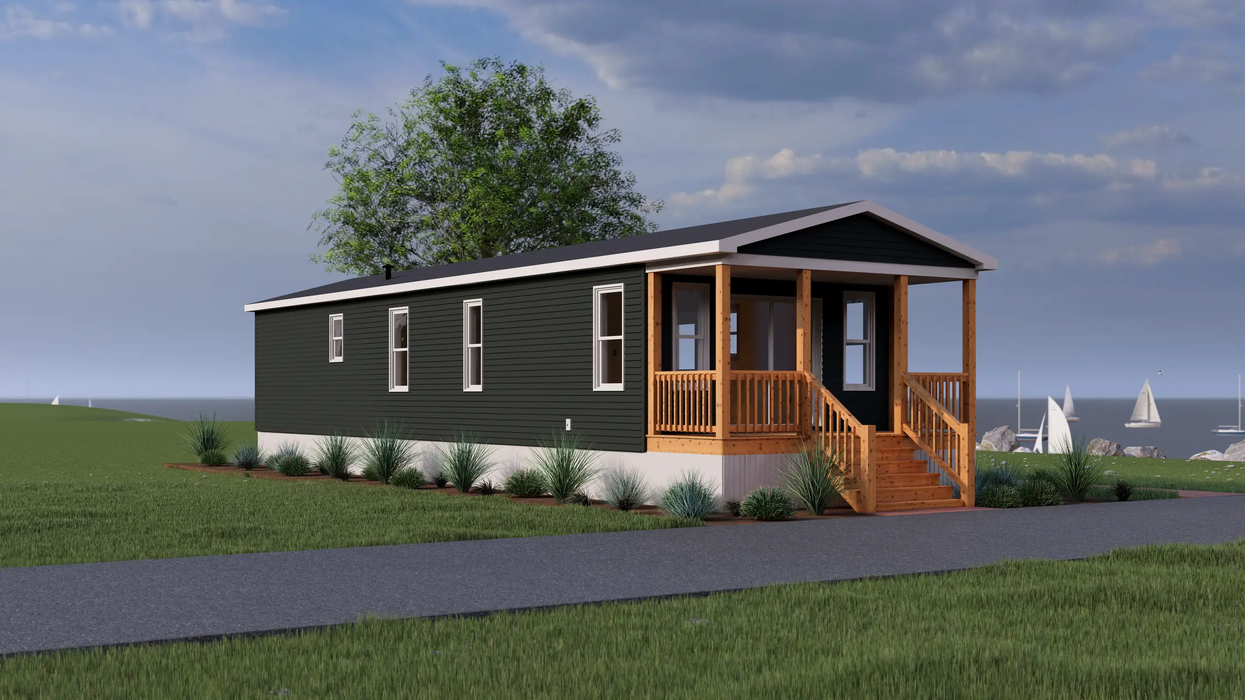 Front corner view of a contemporary mini home showcasing a covered front porch, natural wood railings, dark siding, and coastal-inspired surroundings. 