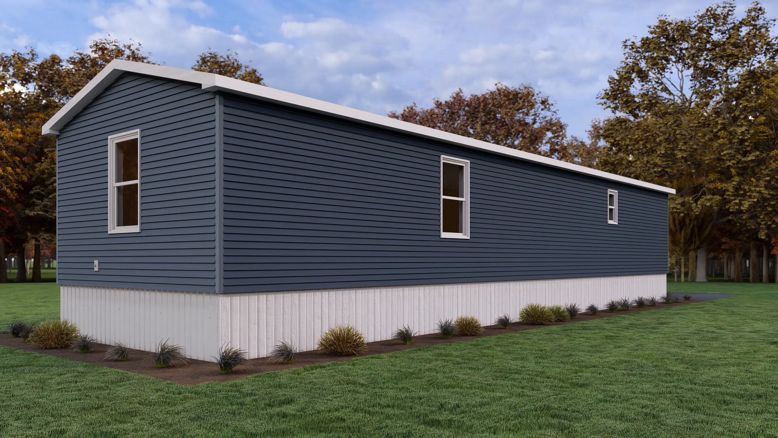 Side view of a contemporary modular home with blue siding, white trim, narrow vertical windows, and foundation landscaping. 